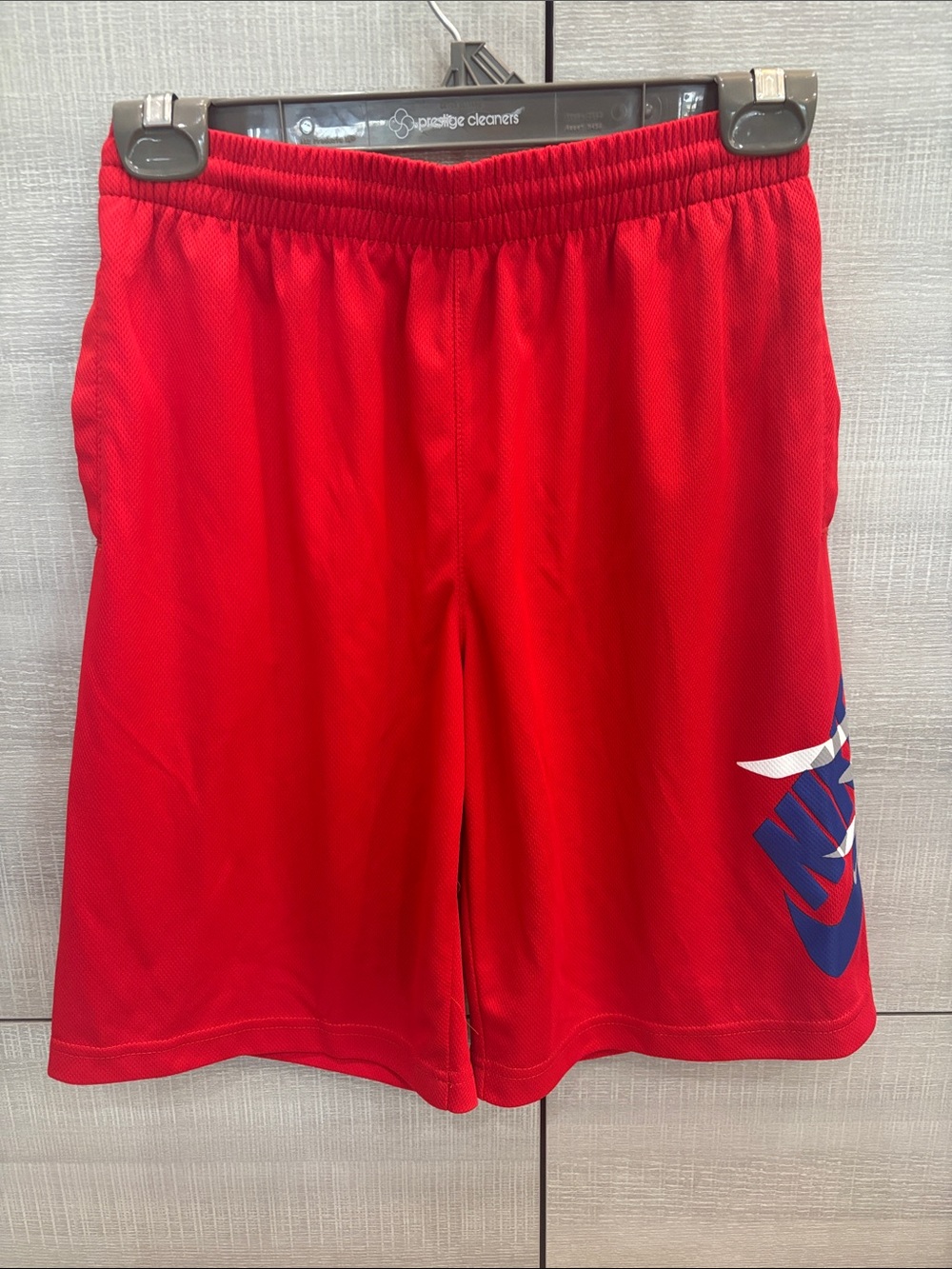 Boy’s Nike Red Athletic Mesh Shorts with Blue Logo